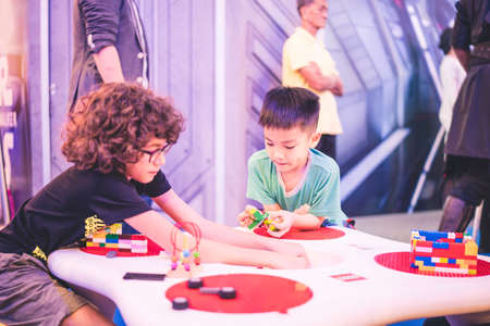 Kuala Lumpur, Malaysia â December, 2019: Children play with Lego blocks at Pavilion Shopping Mall in Bukit Bintang.のeditorial素材