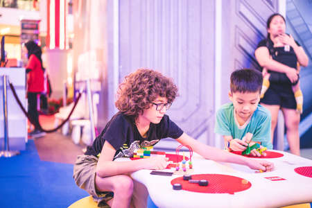 Kuala Lumpur, Malaysia â December, 2019: Children play with Lego blocks at Pavilion Shopping Mall in Bukit Bintang.のeditorial素材
