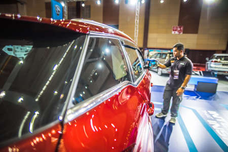 Kuala Lumpur, Malaysia â April 11, 2019 â Car and motocycle displayed at Moto Show in Kuala Lumpur. Exhibitors present most interesting aspects of the automotive industry. The image contains certain grain or noise and soft focus.のeditorial素材