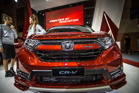 Kuala Lumpur, Malaysia â April 11, 2019 â Car and motocycle displayed at Moto Show in Kuala Lumpur. Exhibitors present most interesting aspects of the automotive industry. The image contains certain grain or noise and soft focus.のeditorial素材