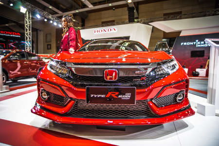 Kuala Lumpur, Malaysia â April 11, 2019 â Car and motocycle displayed at Moto Show in Kuala Lumpur. Exhibitors present most interesting aspects of the automotive industry. The image contains certain grain or noise and soft focus.のeditorial素材