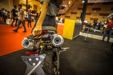 Kuala Lumpur, Malaysia â April 11, 2019 â Car and motocycle displayed at Moto Show in Kuala Lumpur. Exhibitors present most interesting aspects of the automotive industry. The image contains certain grain or noise and soft focus.のeditorial素材