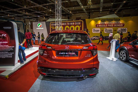 Kuala Lumpur, Malaysia â April 11, 2019 â Car and motocycle displayed at Moto Show in Kuala Lumpur. Exhibitors present most interesting aspects of the automotive industry. The image contains certain grain or noise and soft focus.のeditorial素材