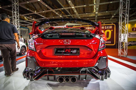 Kuala Lumpur, Malaysia â April 11, 2019 â Car and motocycle displayed at Moto Show in Kuala Lumpur. Exhibitors present most interesting aspects of the automotive industry. The image contains certain grain or noise and soft focus.のeditorial素材