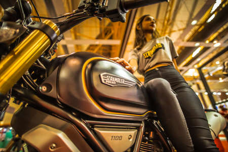 Kuala Lumpur, Malaysia â April 11, 2019 â Car and motocycle displayed at Moto Show in Kuala Lumpur. Exhibitors present most interesting aspects of the automotive industry. The image contains certain grain or noise and soft focus.のeditorial素材