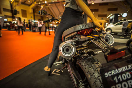 Kuala Lumpur, Malaysia â April 11, 2019 â Car and motocycle displayed at Moto Show in Kuala Lumpur. Exhibitors present most interesting aspects of the automotive industry. The image contains certain grain or noise and soft focus.のeditorial素材
