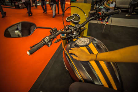 Kuala Lumpur, Malaysia â April 11, 2019 â Car and motocycle displayed at Moto Show in Kuala Lumpur. Exhibitors present most interesting aspects of the automotive industry. The image contains certain grain or noise and soft focus.のeditorial素材