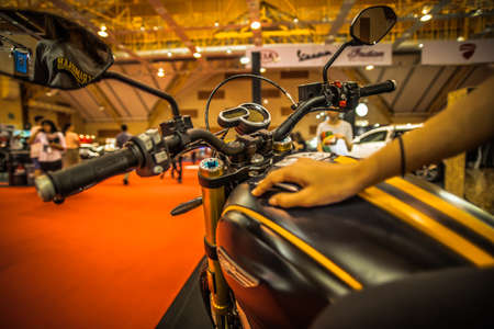 Kuala Lumpur, Malaysia â April 11, 2019 â Car and motocycle displayed at Moto Show in Kuala Lumpur. Exhibitors present most interesting aspects of the automotive industry. The image contains certain grain or noise and soft focus.のeditorial素材