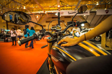 Kuala Lumpur, Malaysia â April 11, 2019 â Car and motocycle displayed at Moto Show in Kuala Lumpur. Exhibitors present most interesting aspects of the automotive industry. The image contains certain grain or noise and soft focus.のeditorial素材