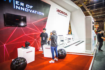 Kuala Lumpur, Malaysia â April 11, 2019 â Car and motocycle displayed at Moto Show in Kuala Lumpur. Exhibitors present most interesting aspects of the automotive industry. The image contains certain grain or noise and soft focus.のeditorial素材