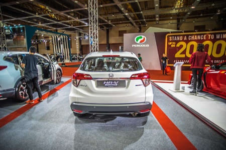 Kuala Lumpur, Malaysia â April 11, 2019 â Car and motocycle displayed at Moto Show in Kuala Lumpur. Exhibitors present most interesting aspects of the automotive industry. The image contains certain grain or noise and soft focus.のeditorial素材
