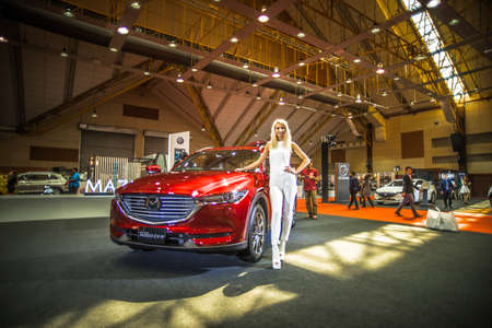 Kuala Lumpur, Malaysia â April 11, 2019 â Car and motocycle displayed at Moto Show in Kuala Lumpur. Exhibitors present most interesting aspects of the automotive industry. The image contains certain grain or noise and soft focus.のeditorial素材