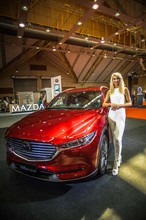 Kuala Lumpur, Malaysia â April 11, 2019 â Car and motocycle displayed at Moto Show in Kuala Lumpur. Exhibitors present most interesting aspects of the automotive industry. The image contains certain grain or noise and soft focus.のeditorial素材