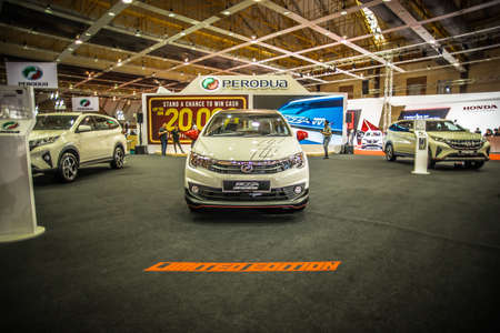 Kuala Lumpur, Malaysia â April 11, 2019 â Car and motocycle displayed at Moto Show in Kuala Lumpur. Exhibitors present most interesting aspects of the automotive industry. The image contains certain grain or noise and soft focus.のeditorial素材