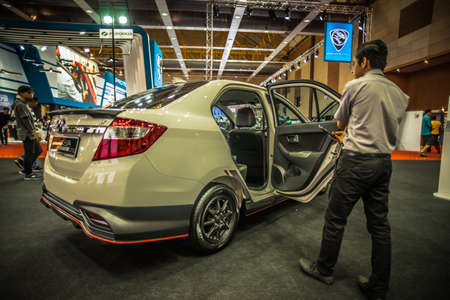 Kuala Lumpur, Malaysia â April 11, 2019 â Car and motocycle displayed at Moto Show in Kuala Lumpur. Exhibitors present most interesting aspects of the automotive industry. The image contains certain grain or noise and soft focus.のeditorial素材