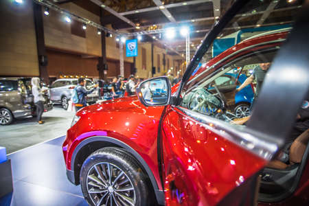 Kuala Lumpur, Malaysia â April 11, 2019 â Car and motocycle displayed at Moto Show in Kuala Lumpur. Exhibitors present most interesting aspects of the automotive industry. The image contains certain grain or noise and soft focus.のeditorial素材