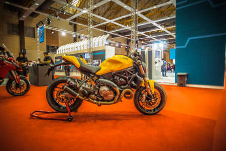Kuala Lumpur, Malaysia â April 11, 2019 â Car and motocycle displayed at Moto Show in Kuala Lumpur. Exhibitors present most interesting aspects of the automotive industry. The image contains certain grain or noise and soft focus.のeditorial素材