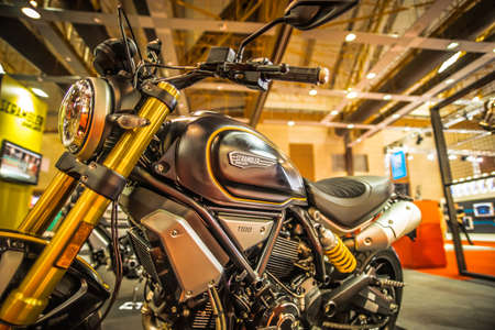 Kuala Lumpur, Malaysia â April 11, 2019 â Car and motocycle displayed at Moto Show in Kuala Lumpur. Exhibitors present most interesting aspects of the automotive industry. The image contains certain grain or noise and soft focus.のeditorial素材