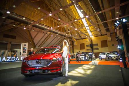Kuala Lumpur, Malaysia â April 11, 2019 â Car and motocycle displayed at Moto Show in Kuala Lumpur. Exhibitors present most interesting aspects of the automotive industry. The image contains certain grain or noise and soft focus.のeditorial素材