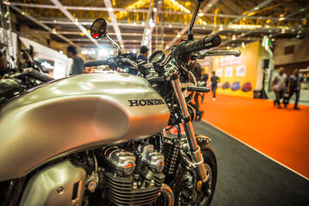 Kuala Lumpur, Malaysia â April 11, 2019 â Car and motocycle displayed at Moto Show in Kuala Lumpur. Exhibitors present most interesting aspects of the automotive industry. The image contains certain grain or noise and soft focus.のeditorial素材