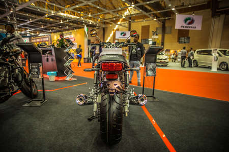 Kuala Lumpur, Malaysia â April 11, 2019 â Car and motocycle displayed at Moto Show in Kuala Lumpur. Exhibitors present most interesting aspects of the automotive industry. The image contains certain grain or noise and soft focus.のeditorial素材