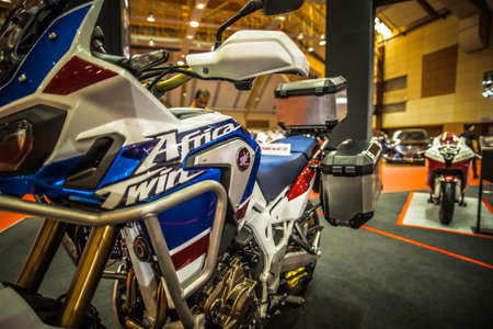 Kuala Lumpur, Malaysia â April 11, 2019 â Car and motocycle displayed at Moto Show in Kuala Lumpur. Exhibitors present most interesting aspects of the automotive industry. The image contains certain grain or noise and soft focus.のeditorial素材