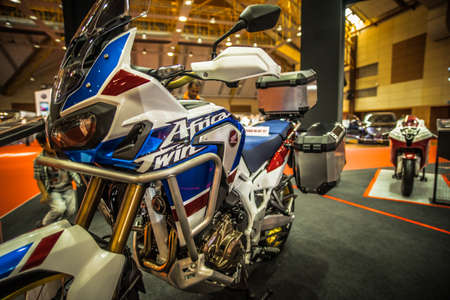 Kuala Lumpur, Malaysia â April 11, 2019 â Car and motocycle displayed at Moto Show in Kuala Lumpur. Exhibitors present most interesting aspects of the automotive industry. The image contains certain grain or noise and soft focus.のeditorial素材