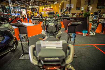 Kuala Lumpur, Malaysia â April 11, 2019 â Car and motocycle displayed at Moto Show in Kuala Lumpur. Exhibitors present most interesting aspects of the automotive industry. The image contains certain grain or noise and soft focus.のeditorial素材