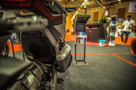 Kuala Lumpur, Malaysia â April 11, 2019 â Car and motocycle displayed at Moto Show in Kuala Lumpur. Exhibitors present most interesting aspects of the automotive industry. The image contains certain grain or noise and soft focus.のeditorial素材