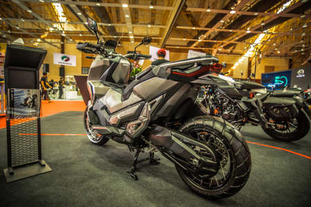 Kuala Lumpur, Malaysia â April 11, 2019 â Car and motocycle displayed at Moto Show in Kuala Lumpur. Exhibitors present most interesting aspects of the automotive industry. The image contains certain grain or noise and soft focus.のeditorial素材