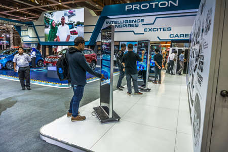 Kuala Lumpur, Malaysia â April 11, 2019 â Car and motocycle displayed at Moto Show in Kuala Lumpur. Exhibitors present most interesting aspects of the automotive industry. The image contains certain grain or noise and soft focus.のeditorial素材
