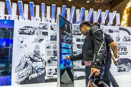 Kuala Lumpur, Malaysia â April 11, 2019 â Car and motocycle displayed at Moto Show in Kuala Lumpur. Exhibitors present most interesting aspects of the automotive industry. The image contains certain grain or noise and soft focus.のeditorial素材