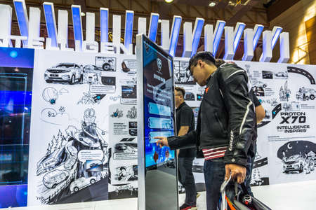 Kuala Lumpur, Malaysia â April 11, 2019 â Car and motocycle displayed at Moto Show in Kuala Lumpur. Exhibitors present most interesting aspects of the automotive industry. The image contains certain grain or noise and soft focus.のeditorial素材