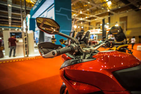 Kuala Lumpur, Malaysia  April 11, 2019  Car and motocycle displayed at Moto Show in Kuala Lumpur. Exhibitors present most interesting aspects of the automotive industry. The image contains certain grain or noise and soft focus.のeditorial素材