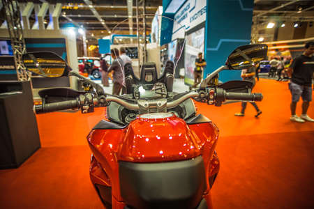 Kuala Lumpur, Malaysia â April 11, 2019 â Car and motocycle displayed at Moto Show in Kuala Lumpur. Exhibitors present most interesting aspects of the automotive industry. The image contains certain grain or noise and soft focus.のeditorial素材