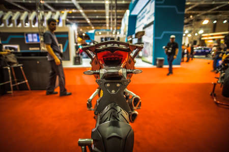 Kuala Lumpur, Malaysia â April 11, 2019 â Car and motocycle displayed at Moto Show in Kuala Lumpur. Exhibitors present most interesting aspects of the automotive industry. The image contains certain grain or noise and soft focus.のeditorial素材