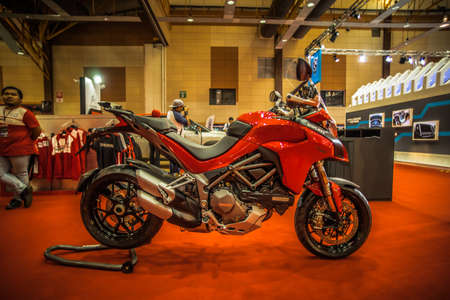 Kuala Lumpur, Malaysia â April 11, 2019 â Car and motocycle displayed at Moto Show in Kuala Lumpur. Exhibitors present most interesting aspects of the automotive industry. The image contains certain grain or noise and soft focus.のeditorial素材
