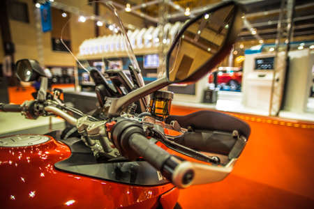Kuala Lumpur, Malaysia â April 11, 2019 â Car and motocycle displayed at Moto Show in Kuala Lumpur. Exhibitors present most interesting aspects of the automotive industry. The image contains certain grain or noise and soft focus.のeditorial素材