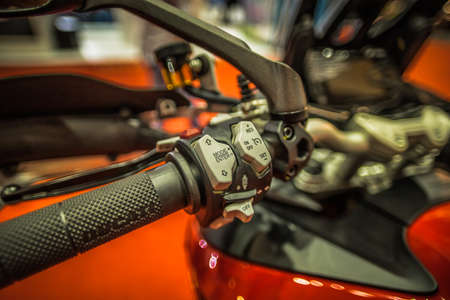 Kuala Lumpur, Malaysia â April 11, 2019 â Car and motocycle displayed at Moto Show in Kuala Lumpur. Exhibitors present most interesting aspects of the automotive industry. The image contains certain grain or noise and soft focus.のeditorial素材