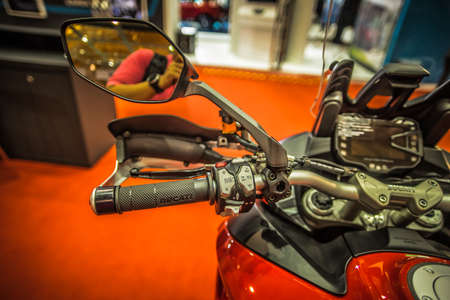 Kuala Lumpur, Malaysia â April 11, 2019 â Car and motocycle displayed at Moto Show in Kuala Lumpur. Exhibitors present most interesting aspects of the automotive industry. The image contains certain grain or noise and soft focus.のeditorial素材