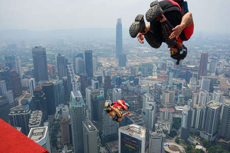 Kuala Lumpur, Malaysia â September 29, 2018: Base Jumpers landed from a 300m high deck during the Kuala Lumpur Tower International Jump.のeditorial素材