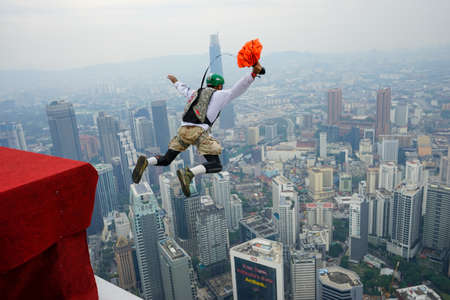 Kuala Lumpur, Malaysia â September 29, 2018: Base Jumpers landed from a 300m high deck during the Kuala Lumpur Tower International Jump.のeditorial素材