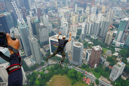 Kuala Lumpur, Malaysia â September 29, 2018: Base Jumpers landed from a 300m high deck during the Kuala Lumpur Tower International Jump.のeditorial素材