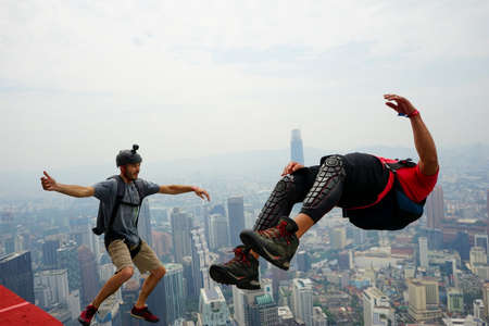 Kuala Lumpur, Malaysia â September 29, 2018: Base Jumpers landed from a 300m high deck during the Kuala Lumpur Tower International Jump.のeditorial素材