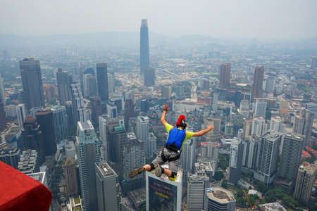 Kuala Lumpur, Malaysia â September 29, 2018: Base Jumpers landed from a 300m high deck during the Kuala Lumpur Tower International Jump.のeditorial素材