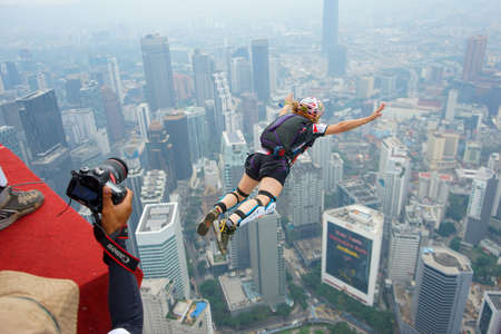 Kuala Lumpur, Malaysia â September 29, 2018: Base Jumpers landed from a 300m high deck during the Kuala Lumpur Tower International Jump.のeditorial素材