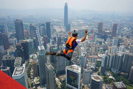 Kuala Lumpur, Malaysia â September 29, 2018: Base Jumpers landed from a 300m high deck during the Kuala Lumpur Tower International Jump.のeditorial素材