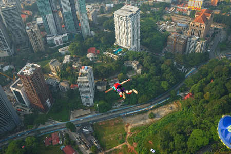Kuala Lumpur, Malaysia â September 29, 2018: Base Jumpers landed from a 300m high deck during the Kuala Lumpur Tower International Jump.のeditorial素材