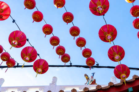 The beautiful decoration of Red Lantern during  Chinese New Year at the temple. The image contains certain grain or noise and soft focus.の写真素材
