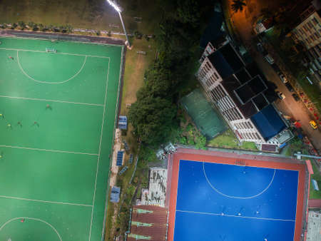 Aerial birdâs eye view of the outdoor hockey field at night. The image contains soft-focus, grain, and noise.のeditorial素材